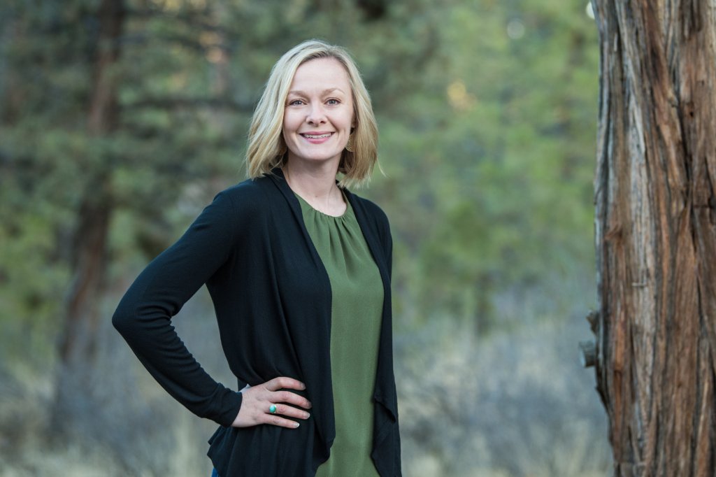 Jessi Massingale standing in a forested area
